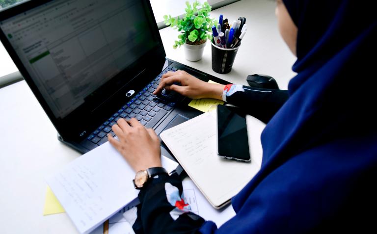 Woman working at laptop